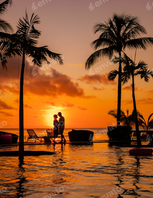 Preview: Man and Woman relaxing in a swimming pool, a couple on a honeymoon vacation in Mauritius