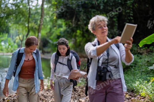 Preview: Backpack tourist travel outdoor adventure bird study using binoculars looking and record to book