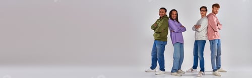 Preview: multicultural men standing back to back and smiling at camera on grey backdrop, diversity, banner