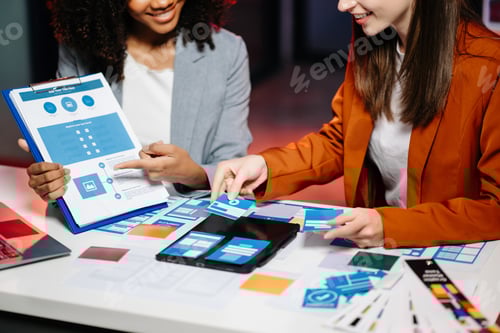 Preview: UX developer and ui designer brainstorming about mobile app interface wireframe design