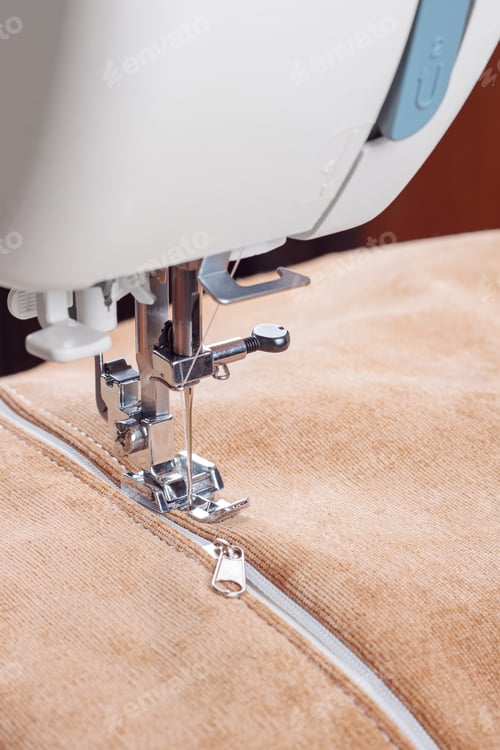 Preview: Modern Sewing Machine Special Presser Foot With Beige Fabric And Zipper, Closeup
