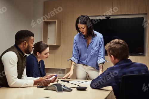 Preview: Shot of a businesswoman giving a presentation to her colleagues in an office