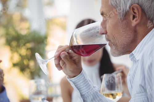 Preview: Man having wine at the restaurant