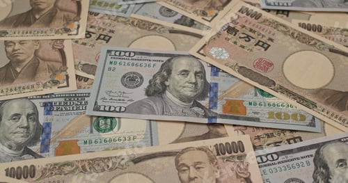 Preview: Stack of Japanese yen and USD