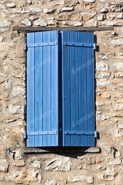 Preview: House facade with blue shutters in France