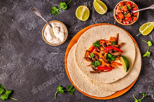 Preview: FAJITAS with colored pepper and onions, served with tortillas.