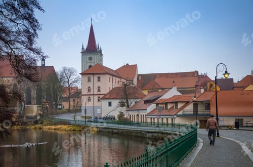 Preview: Man on embankment in small Czech town