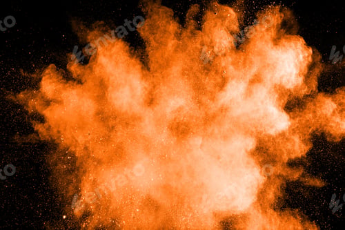 Preview: Abstract orange powder explosion on white background.Freeze motion of orange dust splash.
