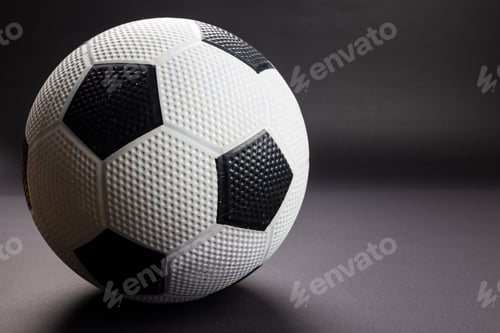 Preview: Composition of football on black background with copy space