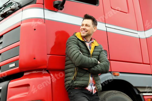 Preview: Portrait of happy driver at modern truck outdoors