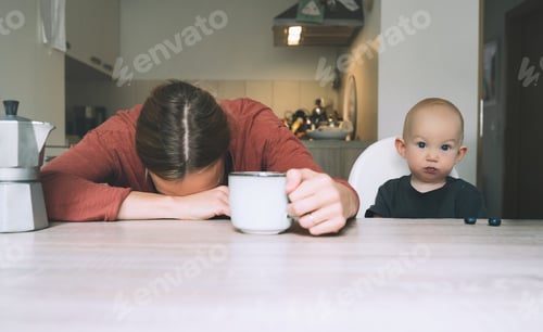 Preview: Modern tired mother and little child after sleepless night.