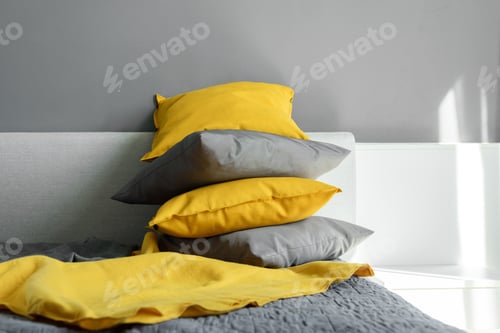 Preview: Color pillows illuminating ultimate gray pile on bed Two trendy 2021 colors of years Modern interior