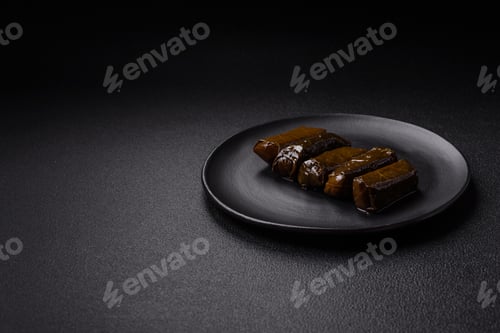 Preview: Stuffed Grape Leaves on a Black Plate