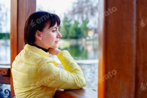 Preview: Young woman deep in thoughts.
