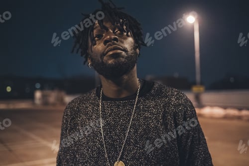 Preview: portrait of young african man standing outdoor