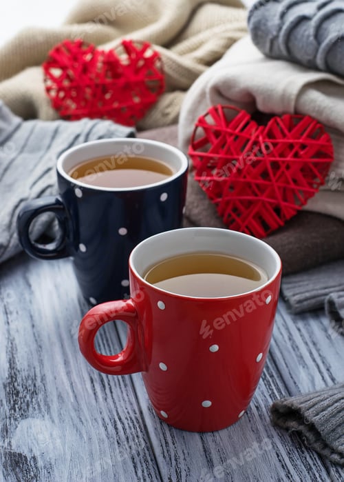 Preview: Warm knitted pastel clothes and cups