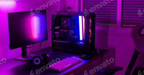 Preview: A computer setup with a purple light dark background, games transmission modern equipment, modern