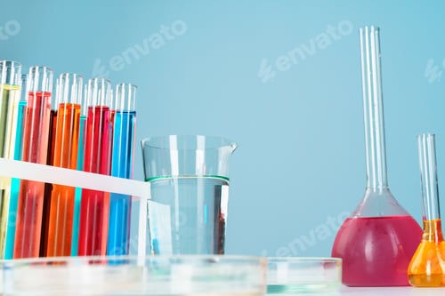 Preview: Chemical laboratory glassware with various colored liquids on table