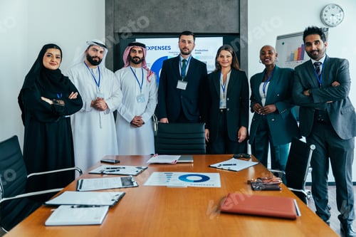 Preview: Diverse international business team standing in meeting room