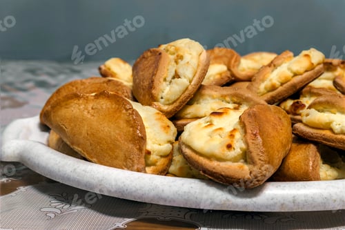 Preview: Puff pastry with cheese on a wooden background. Homemade baking