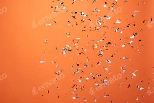 Preview: shiny silver confetti on orange background