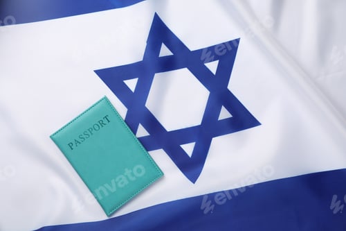 Preview: Passport in light blue cover on flag of Israel, top view. Space for text