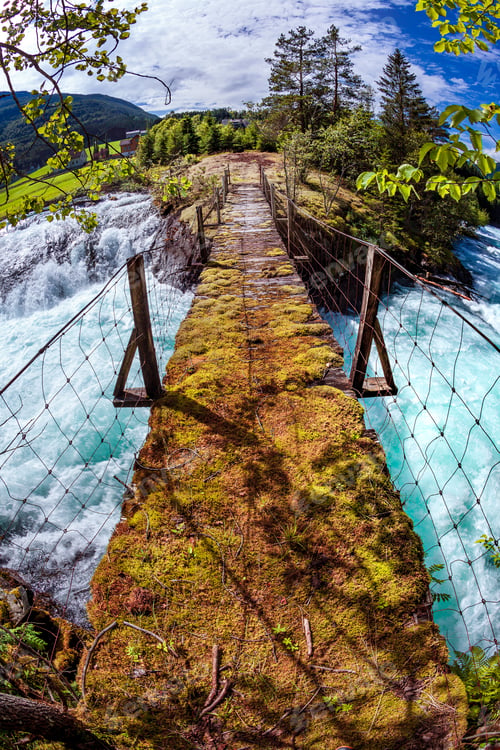 Preview: Suspension bridge over the mountain river, Norway.