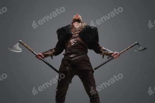 Preview: Furious nordic warrior with paired axes against gray background