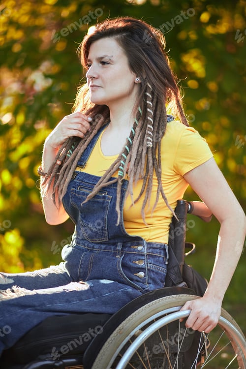 Preview: young attractive girl learning to use wheelchair