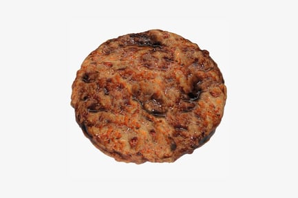 Preview: Close-up of sauce-covered fried patty with vegetables