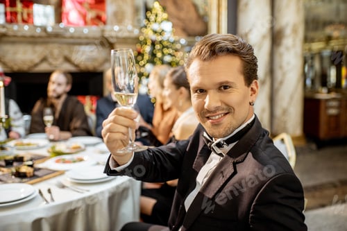 Preview: Man with friends during a festive dinner on New Years Eve