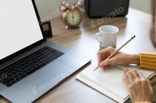 Preview: asian female student watching lesson online and studying distantly. Young woman takes notes