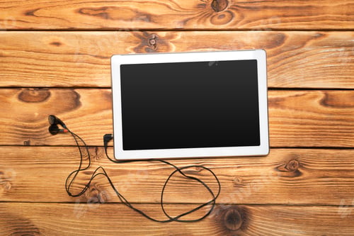 Preview: White digital tablet on wooden table