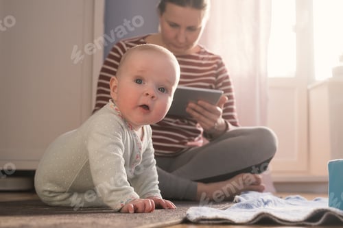 Preview: Caucasian mother with baby spending time together.