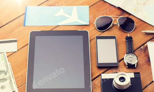 Preview: close up of smartphone and travel stuff