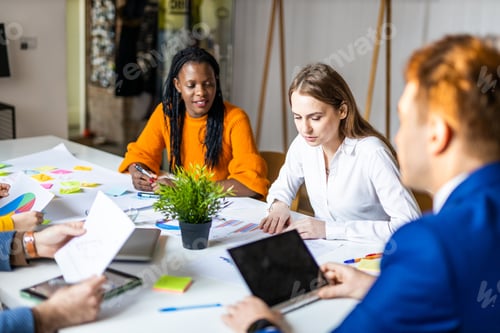Preview: Business team working in a start-up office