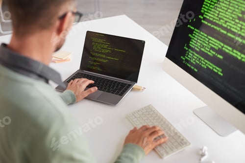 Preview: Programmer working on computer