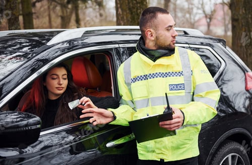 Preview: Male police officer in green uniform takes bribe from woman in car