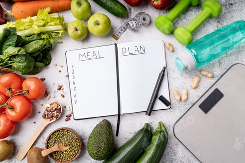 Preview: Weight lose and dieting concept. Notepad with words Meal Plan with healthy foods and sport equipment