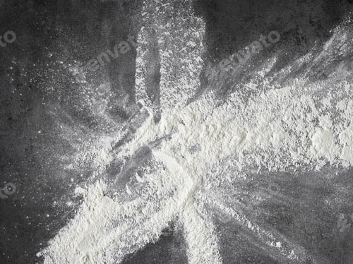 Preview: white flour on black kitchen table