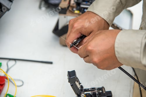 Preview: Technicians are cutting fiber optic cables.