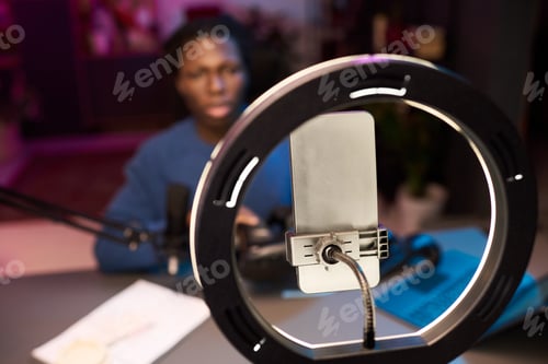 Preview: African American Man Recording Blog with Smartphone, Ring Light and Microphone