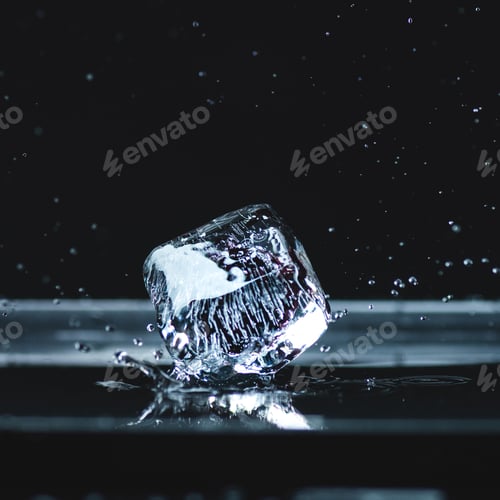 Preview: close-up view of shiny melting ice cube with water drops on black