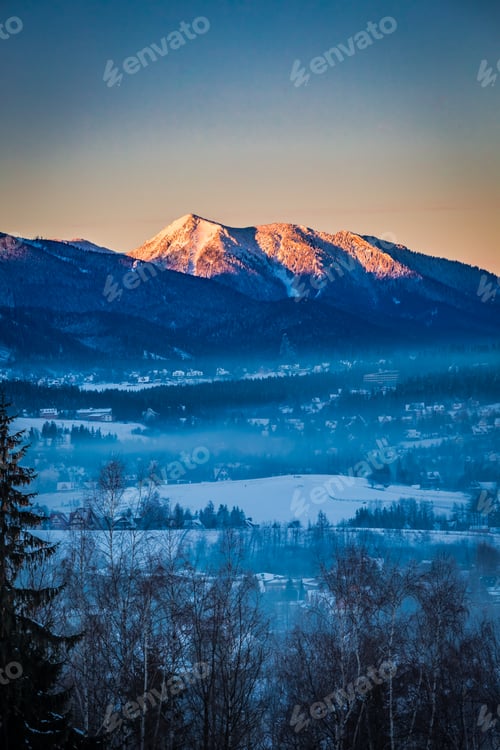 Preview: Sunrise in Zakopane with illuminated peak in winter, Tatra Mountains, Poland