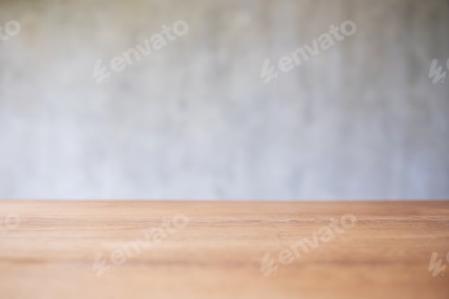 Vista previa: Wooden table top with blurred of concrete wall background