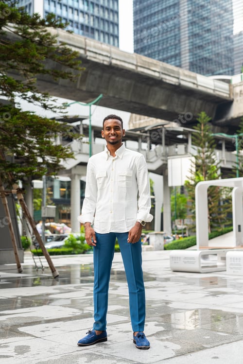 Preview: Full length shot of black man outdoors in city