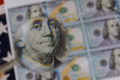 Preview: One Hundred Dollar Bill Under a Magnifying Glass