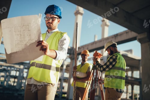 Preview: Portrait of construction engineers working on building site