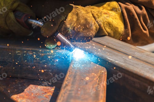 Preview: Welding work, welder welding metal material in heavy industry manufacturing