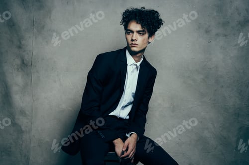 Preview: man in black suit modern style studio official